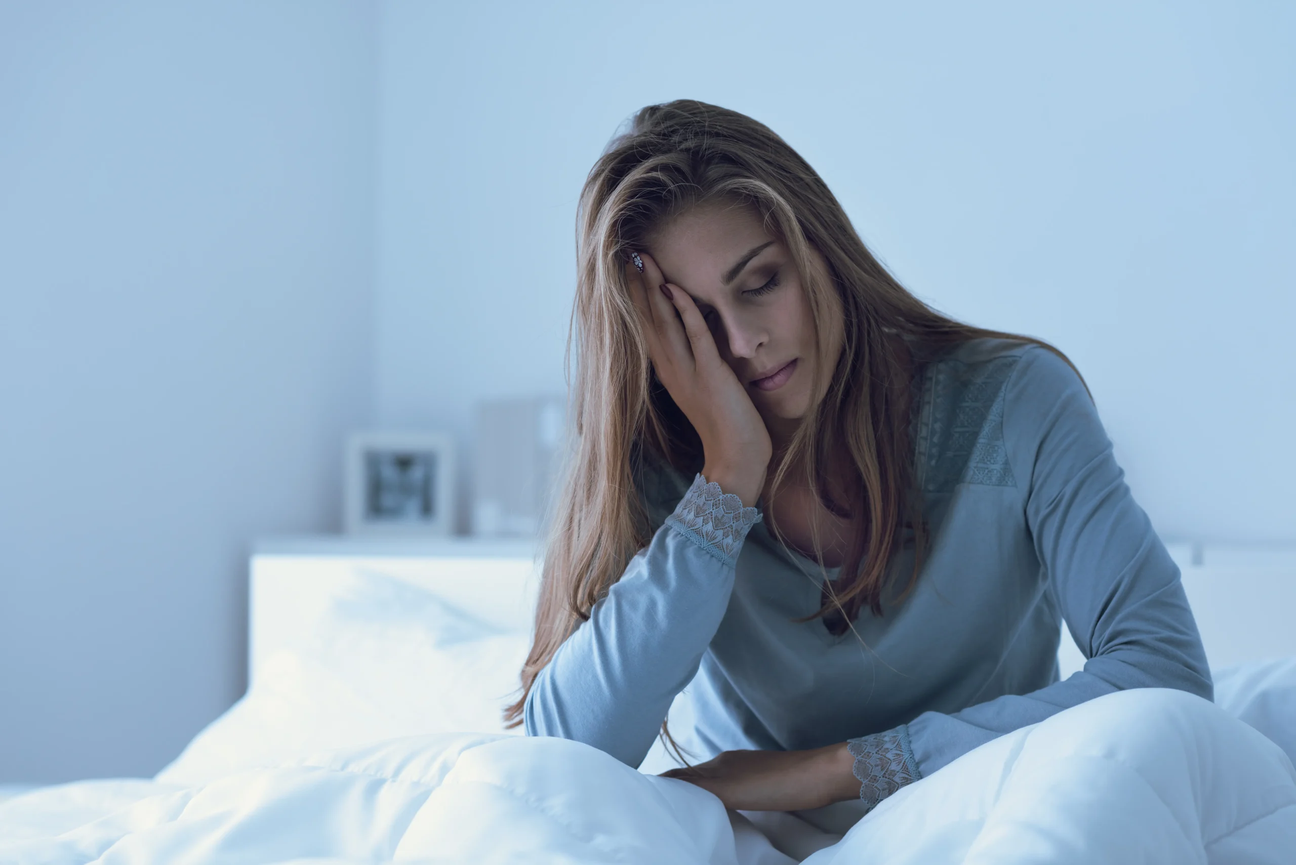 A girl sitting over the bed with closed eyes | nova vitacare | Texas