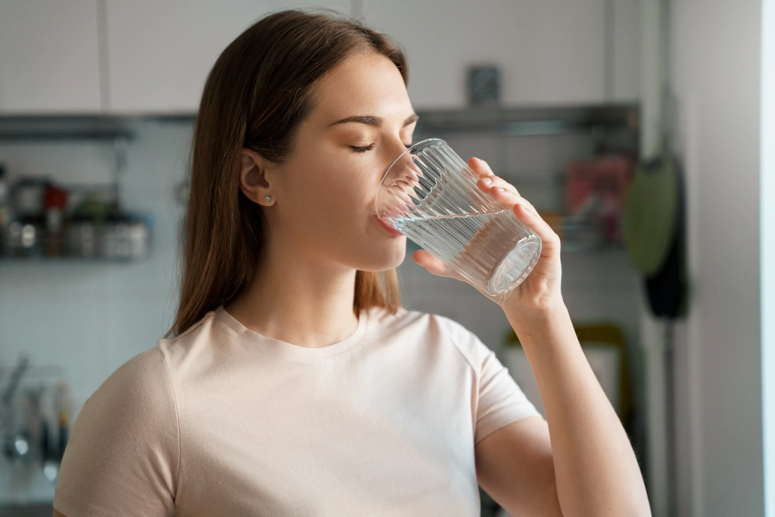 Women drinking glass of water | nova vitacare | Texas